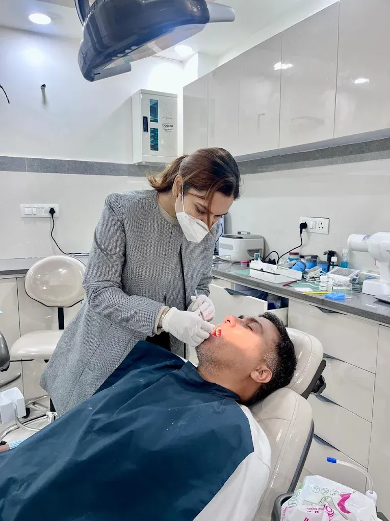 Dr. Pragati Singh treating an adult patient at Vital Dental Care, GMS Road, Dehradun