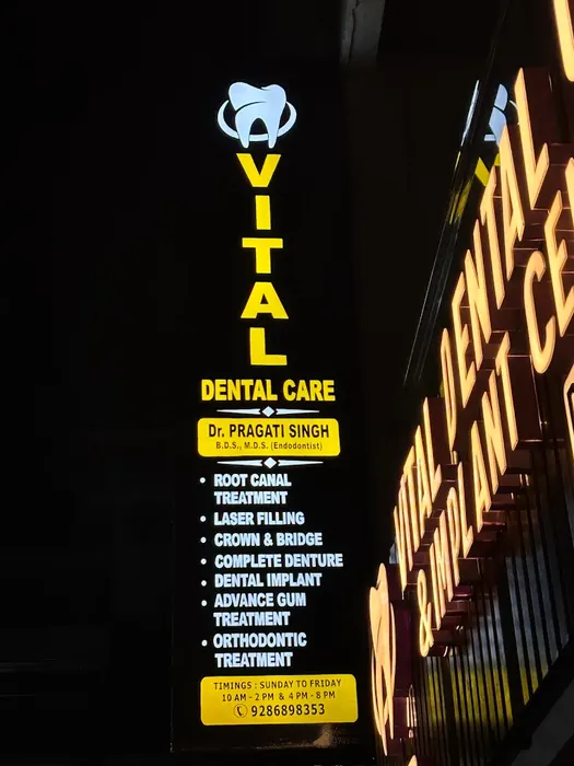 The illuminated Vital Dental Care signboard at night